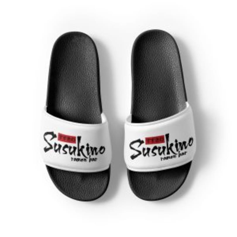 Pair of black and white Susukino Ramen Bar branded slide sandals on a white background.